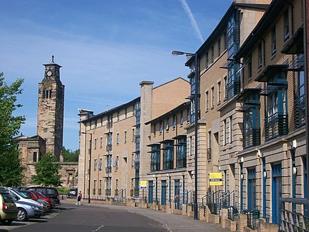Alexander Crescent, Gorbals, in 2011 with Caledonia Road Church [de] tower in background