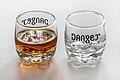 Ambigram Cognac Danger on a set of two shot glasses (full and empty).jpg