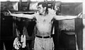 Babe Ruth without shirt and his arms spread wide in his locker room, from- Babe Ruth at bat, with inset cph.3b19138 (cropped).jpg