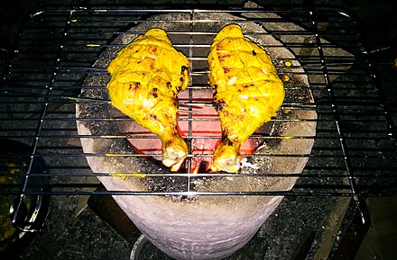 Chicken legs are being barbequed in Assam, India