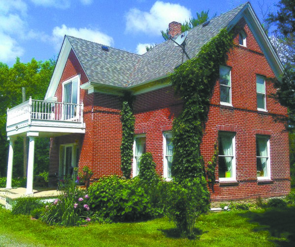 Photo of farmhouse in Pine City, Minnesota, where Bob Mould sequestered himself to write his first solo album, Workbook