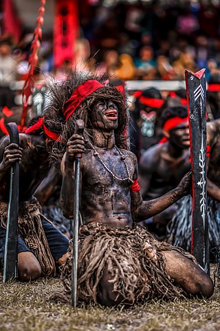 <i>Cakalele</i> dance Indonesian traditional war dance