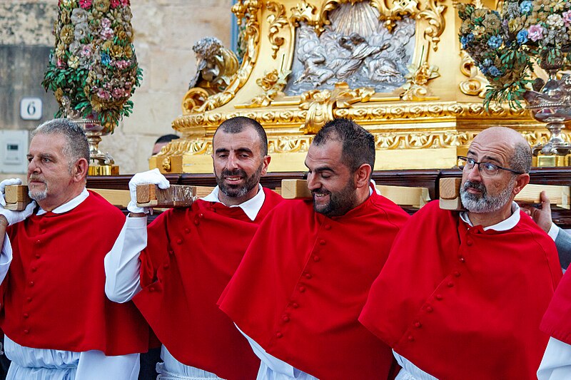 File:Carrying of the statue during village feast.jpg