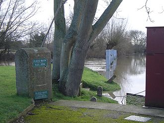 Taken when a high stream is running almost level over the tumbling bay and backwater. The lower marker is the flood level in 2003; the higher marker in 1894 Cliftonlock02.JPG
