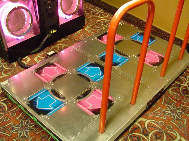 The arcade version of Dance Dance Revolution's two-player dance platform is an example of a hard pad.