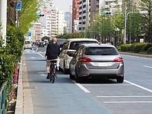 Bike lane separated by parked cars in Hakusan, Japan Door zone bike lane on Hakusan-dori Ave. in Hakusan.jpg