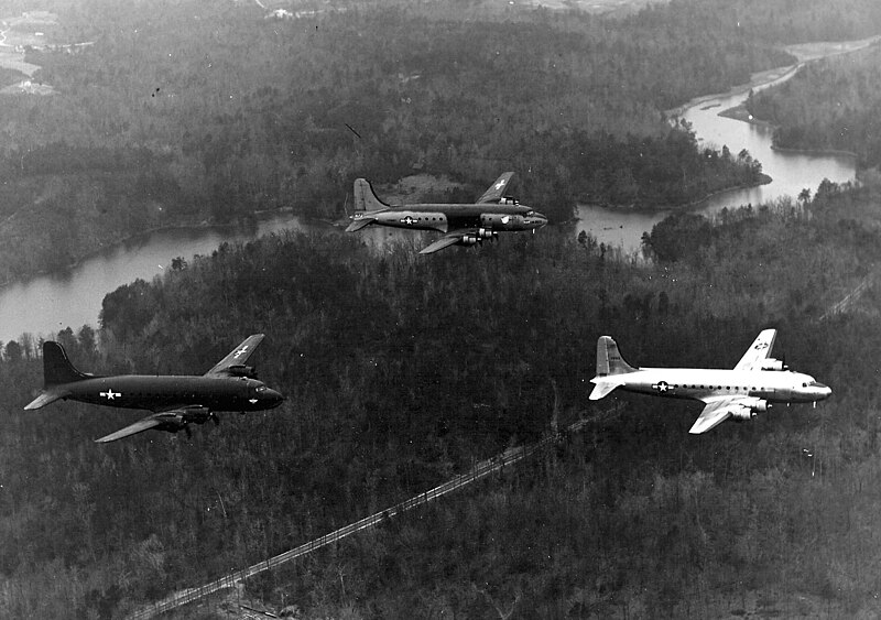 File:Douglas C-54s with different paint schemes over Florida c1945.jpeg