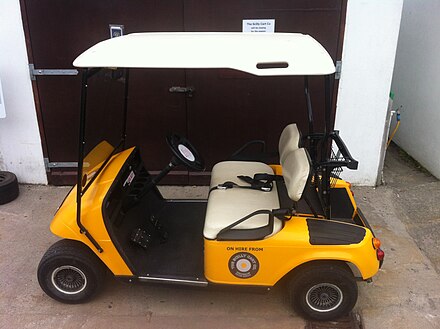 An electric golf buggy on St Mary's; these are road licensed and available for hire, as are bicycles, for use on public roads on the island.