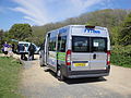 The rear of FYT bus LO08 KPN, a Peugeot Boxer, parked at the bottom of Mottistone Down, Isle of Wight. It was being used to transport children around to various points around Walk the Wight, and is seen here at Mottistone Down. This is a role that had previously been given to Wightbus, until this operation was axed by the Isle of Wight Council in September 2011.