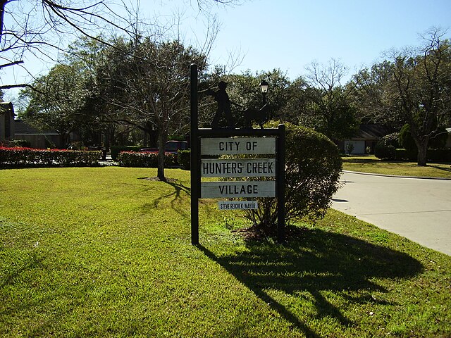 A sign indicating Hunters Creek Village