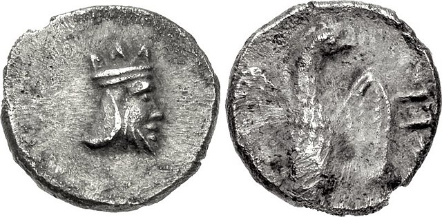 Silver coin (gerah) minted in the Persian province of Yehud, dated c. 375-332 BCE. Obv: Bearded head wearing crown, possibly representing the Persian 
