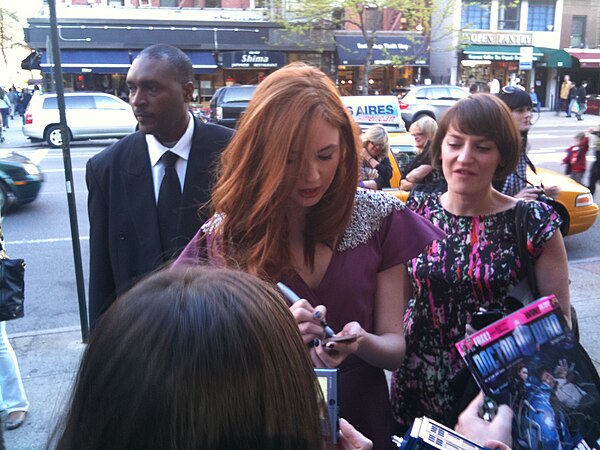 Gillan signing autographs at the US premiere of "The Eleventh Hour"