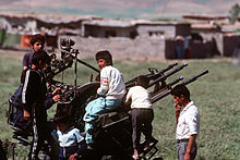 Kurdish children in a refugee camp built during the U.S. and coalition Operation Provide Comfort play on a ZPU gun which was abandoned by Iraqi forces during Operation Desert Storm, 1 May 1991 Kurdish children play on a Soviet-built ZPU-4 in 1991.JPEG