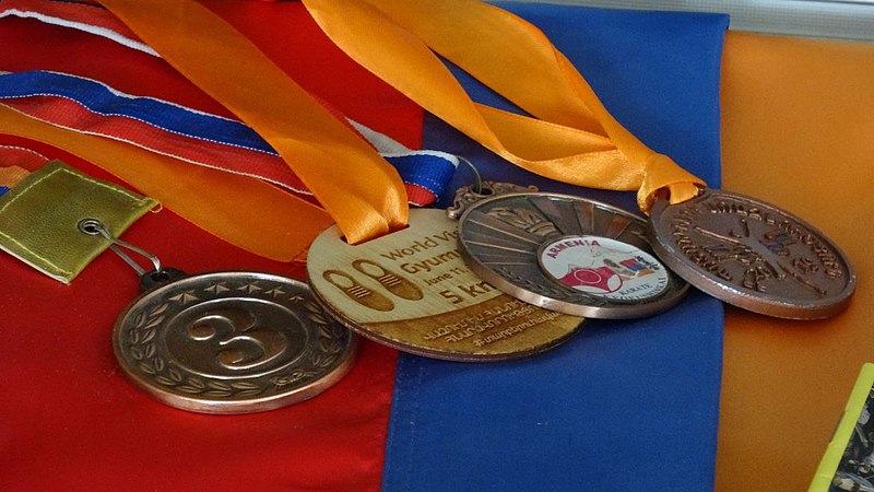 File:Medals with flag.jpg