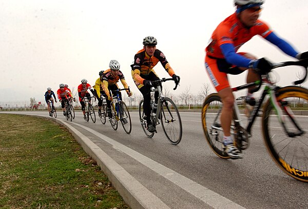 Cyclists drafting behind one another, forming a paceline