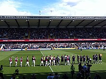 West Ham and Millwall players shake hands before kick-off in 2011. Millwall v West Ham 2011.jpg