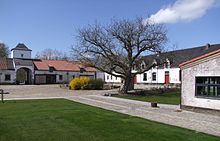 Inner yard of Mont-Saint-Jean Farm which was used as military hospital by the British forces at the end of the Battle of Waterloo. Restored in preparation of the bi-centennial of the Battle of Waterloo, June 2015. It now incorporates a small museum. Mont Saint-Jean.JPG