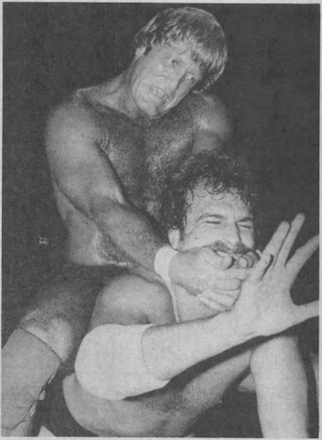 Paul Orndorff applying a chinlock to Jake Roberts