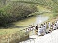 Pilgrims being baptized in the Jordan River (26713071664).jpg