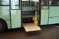 Bus with wheelchair lift extended