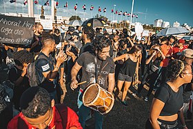 Dominicans in Santo Domingo protest with Afro-Dominican tambora drum. Protestas Plaza de la Bandera dia uno 3.jpg
