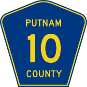 A blue pentagon with yellow text "10" inside, and small yellow text "PUTNAM COUNTY" surrounding the numeral