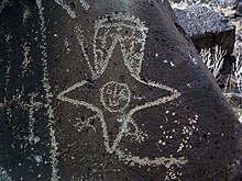 "Star person" petroglyph at Rinconada section, Petroglyph National Monument. This Southern Tiwa feathered star with talons probably represents the Morning Star. Rinconada Star Being.jpg