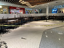 Roped off seating in the Canberra Centre in late October 2021 Roped off seating in the Canberra Centre basement food court October 2021.jpg