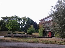 The 2005 classroom building and the park behind the college Sankt-georgen-hochschule-park.jpg