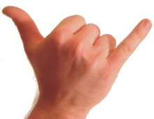 Foto del dorso del polso e della mano umani.  Il pollice e il mignolo sono estesi e le altre dita sono piegate contro il palmo.