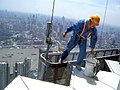 Un laveur de carreaux à Shanghai