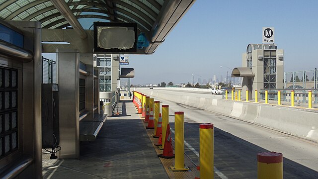 New bollards, security cameras, and digital message signs were added to stations after the start of bus rapid transit as seen here at Slauson station 