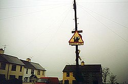 A Sniper at work sign, near Crossmaglen, warns British troops of the presence of the South Armagh Sniper. Sniperatwork.jpg