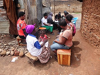 A self-help group in Katwe Social worker in Katwe slum.jpg