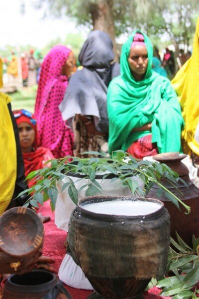 As part of the Camel Milk Value-Chain Development project ceremony, women from Fafan village in the Somali Regional State offer fresh camel milk and o