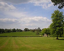 Stowe Gardens, The Hawkwell Field, with the Palladian Bridge on the right and the Gothic Temple on the rising ground straight ahead. Beyond, the Queen's Temple and Lord Cobham's Monument are just visible. Stowe crop2.JPG