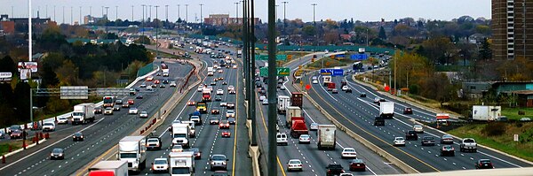 The Ontario Highway 401 in the Greater Toronto area, with 17 travel lanes in 6 separate carriageways visible in the midground