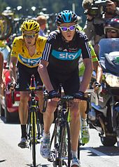 Chris Froome assisting Bradley Wiggins (yellow jersey) in the 2012 Tour de France. Froome went on to win the 2013 Tour de France. Tour de France 2012, wiggins - froome (14683360257) (cropped).jpg