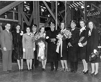 RADM Jules James (center) and assorted dignitaries at the launch party for LSM(R)-407. February, 1945. USSCharitonRiver2.jpg