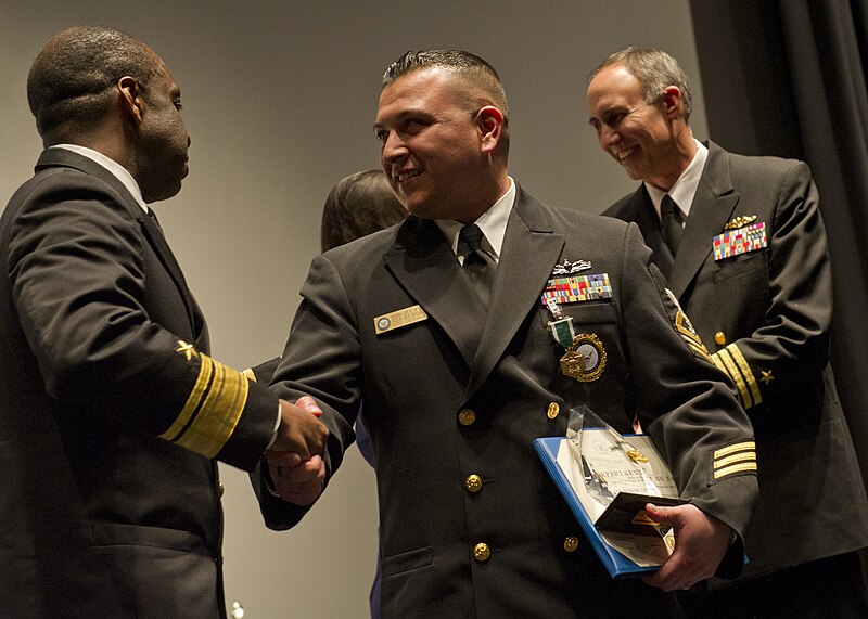 File:US Navy 120125-N-QF368-161 Chief Navy Counselor Julio Menendez, division leading Chief Petty Officer of the Year, shakes hands with Rear Adm. Earl.jpg