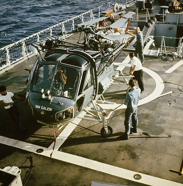 A Westland Wasp with folded rotor blades on the flight deck of Van Galen.