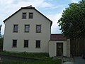 Residential stable house and two barns in a three-sided courtyard