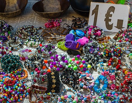 If you'd like to buy some wristbands or other trinkets, it's often cheaper in the end to buy it from a vendor than to accept it as a "gift"