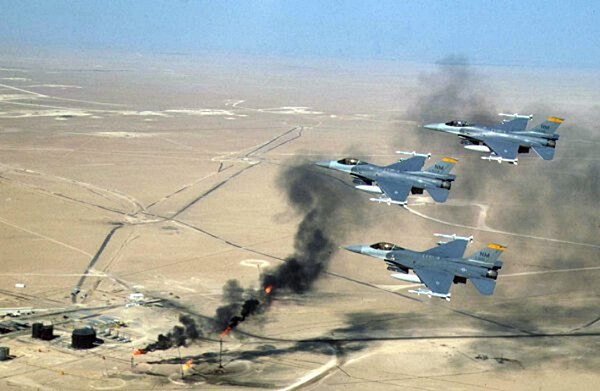 F-16C Fighting Falcons of the 188th Fighter Squadron flying over Kuwaiti oil wells during Operation Southern Watch, 1998