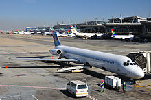 A Hewa Bora Airways McDonnell Douglas MD-82 parked at OR Tambo International Airport, South Africa (2011) 2011-06-28 12-54-36 South Africa - Bonaero Park 9Q-COZ.jpg