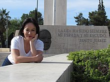 Woman wearing a plain white shirt and jeans Abigail Villegas.jpg