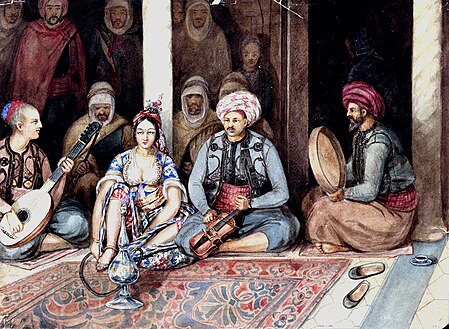 A sitting woman surrounded by men holding musical instruments