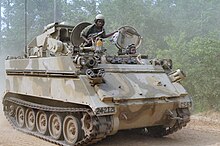 A M901 ITV vehicle from the 1st Platoon, 48th Brigade, 108th Armor Regiment, Georgia National Guard, moves through a recently cleared roadblock during the training Exercise COMPANY TEAM DEFENSE. July 17, 1983 An M901 improved TOW vehicle from the 1st Platoon, 108th Armor Regiment, 48th Brigade, Georgia National Guard, moves through a recently cleared roadblock during the training Exercise COMPANY TEAM DEFENSE.jpg