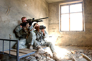 U.S. Army sniper team in Afghanistan. The spotter acts as a "hunter" while the shooter acts as a "killer". Army sniper team Afghanistan.jpg