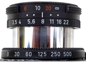 The Carl Zeiss 40mm Triotar lens referred to in Jacobson's lens tutorial. The dots represent DOF limits for f/8 and f/16; the dots indicate that the lens is focused at approximately the hyperfocal distance for f/16, about 13 feet. Jacobson's inferred circle of confusion diameter, using
c
=
f
2
/
(
N
H
)
{\displaystyle c=f\,^{2}/(NH)}
, was about 0.025 mm. B35 Zeiss Triotar40mm.jpg